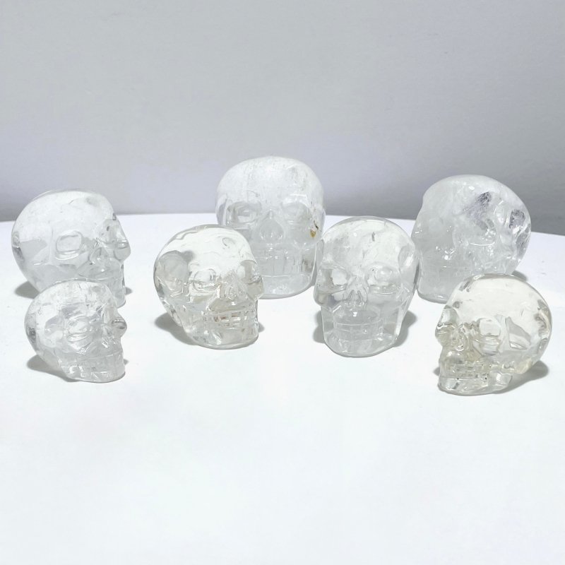 7 Pieces Clear Quartz Skull Carving Closeout - Wholesale Crystals