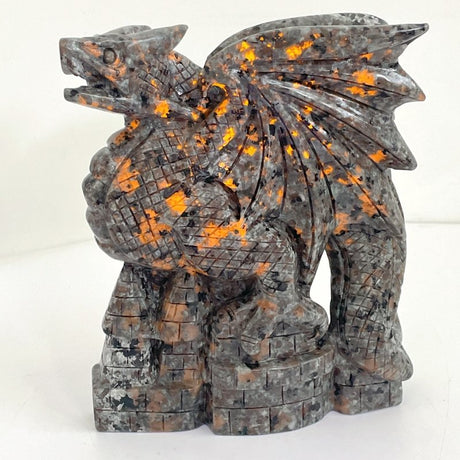 7.1in Unique Yooperlite Flying Dragon With Castle Carving (UV - Reactive) - Wholesale Crystals