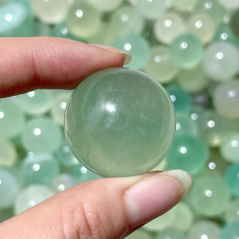 Small Light Green Fluorite Transparent Sphere 1.8 - 3cm Wholesale - Wholesale Crystals